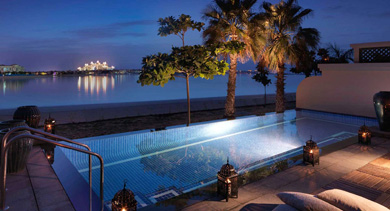 V anantara the palm dubai one bedroom beach villa pool by night 1920x1037